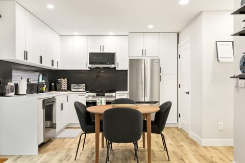 Pull up a seat for breakfast or a work session. Dining table close to kitchen and living room.