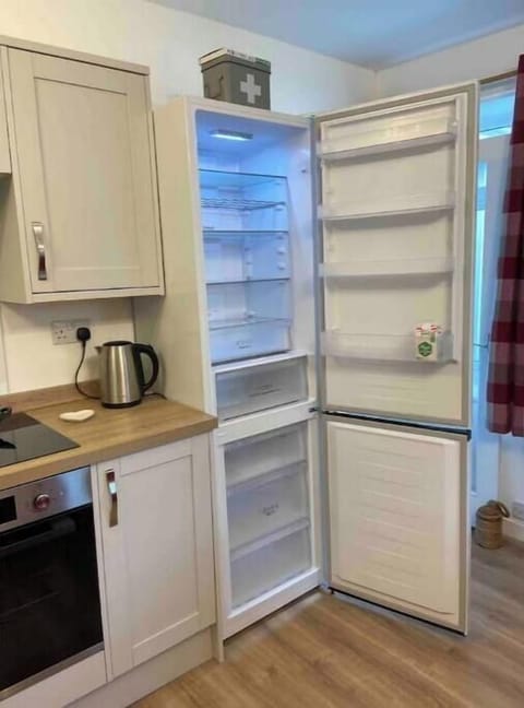 Large fridge-freezer for storing holiday treats. Ice-cube trays provided.