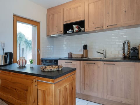 Countertop, Cabinetry, Furniture, Kitchen, Flooring, Kitchen Appliance, Interior Design, Wood, Drawer, Cupboard