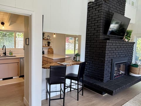 The live-edge bar lets you talk to the chef, while staying out of the kitchen