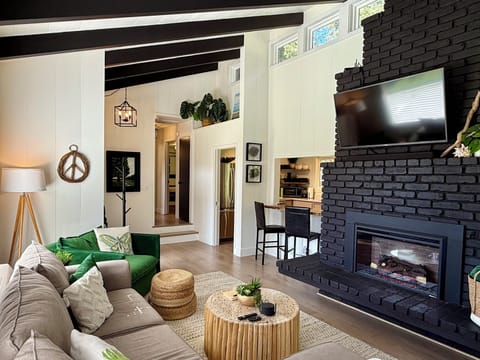 Living Room: *Smart TV w/sound bar *Comfy seating *Electric fireplace *Blankets