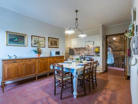 Furniture, Wood, Interior Design, Flooring, Kitchen, Cabinetry, Floor, Room, Major Appliance, Cupboard