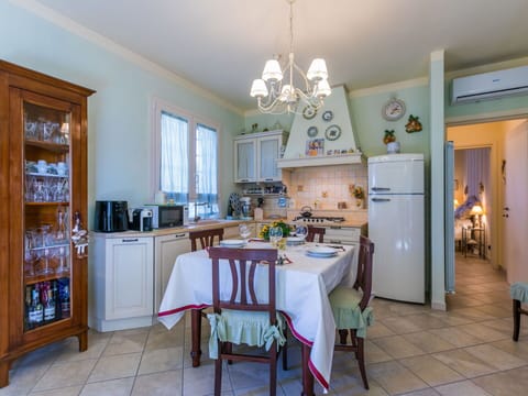 Furniture, Wood, Interior Design, Flooring, Kitchen, Cabinetry, Floor, Room, Major Appliance, Cupboard