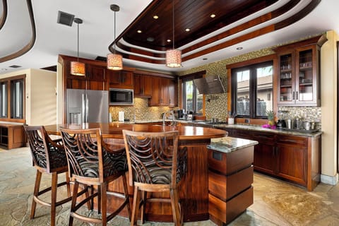 Entertain effortlessly in the spacious kitchen with premium appliances and island seating.