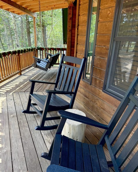 Enjoy time on the front porch on our new swinging bench and rocking chairs