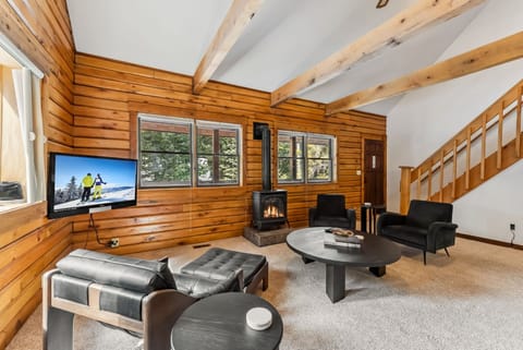 Living room: Gas fireplace, 45” Smart TV with Roku, radiant heat, no A/C, patio access