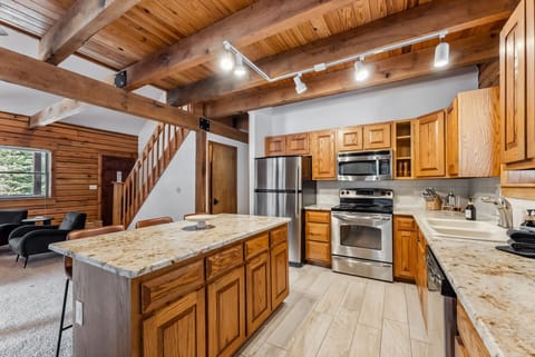 Kitchen: Drip coffee maker, espresso machine, air fryer, cooking utensils, tableware