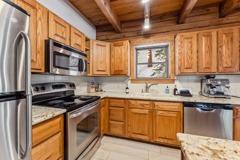 Kitchen: Drip coffee maker, espresso machine, air fryer, cooking utensils, tableware