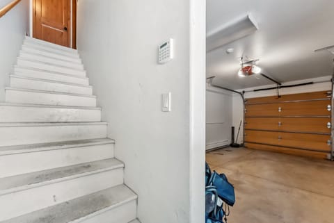 Studio apartment: Garage, stairs leading to upper floor
