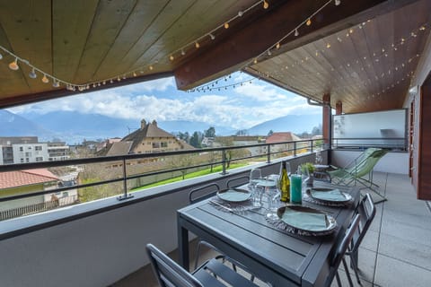 182 sqf terrace with dining table, sun loungers and lake view  
