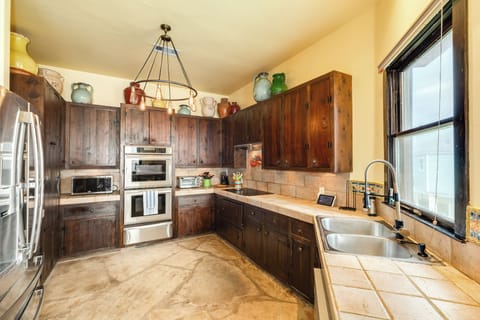 Fully equipped kitchen with stainless steel appliances