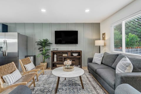 Sink into Comfort! The Living Room Boasts Very Cozy Couches and Chairs, Complete with a Bedside Lamp for a Relaxing Reading Nook