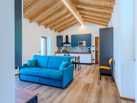 Furniture, Interior Design, Flooring, Wood, Floor, Room, Ceiling, Home, Couch, Lighting