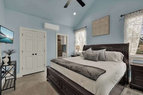 The cozy bedroom offers a plush king bed, perfect for stretching out and enjoying a restful night’s sleep.