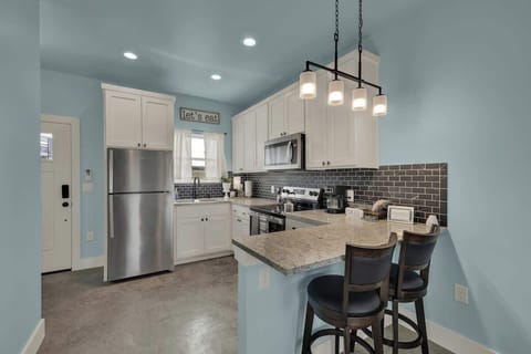 The full kitchen comes equipped with modern appliances, ample counter space, and all the essentials you need to prepare delicious meals during your stay.