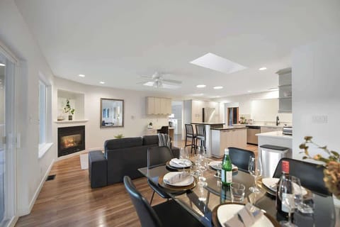 Main level dining, living and kitchen open plan.