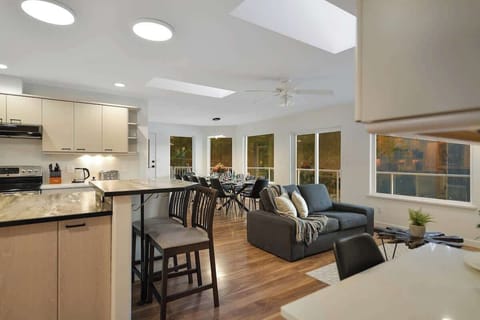 Main level dining, living and kitchen open plan.