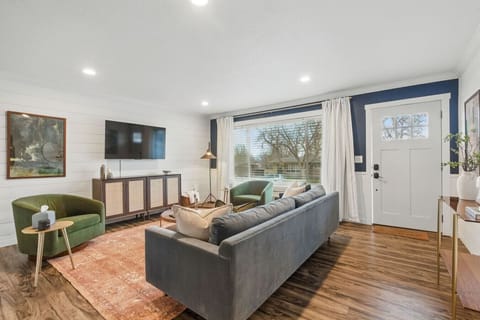 Spacious living room with smart TV and tons of natural light