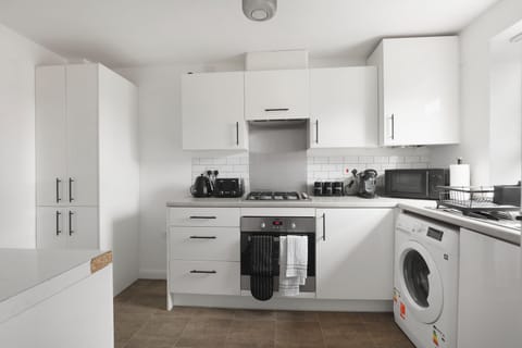 Cook, brew, and bake with ease—this modern kitchen comes with all the comforts of home