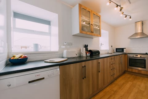 The Carthouse galley style kitchen at Trevalgan Farm Holidays