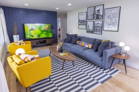 [Living Room] - Enjoy watching included live TV and Netflix on the 75" 4K UHD TV. One of 5 throughout the house!