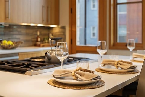 Kitchen: gas stove, island with seating for 3, coffee machine