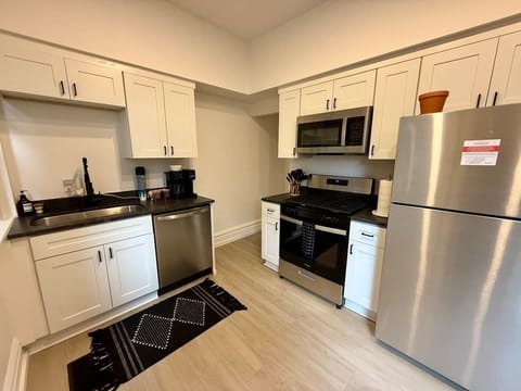 Enjoy your mornings in our modern Jungle House kitchen in Columbus! Our Keurig coffee maker is ready to fuel your adventures. & Our plants are looking forward to hosting you soon Book your stay now and experience the perfect blend of comfort and