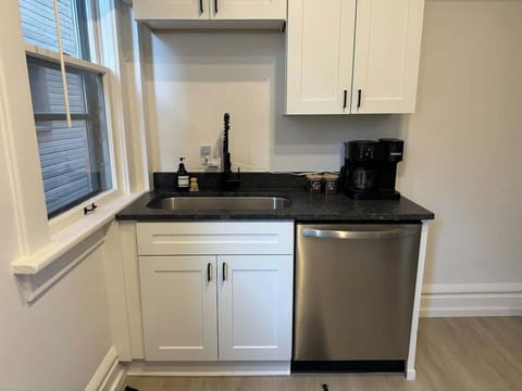 Elevate your culinary experience at Jungle House Airbnb with our sleek and modern kitchen, complete with stainless steel appliances and elegant finishes Your gourmet retreat in Short North Columbus