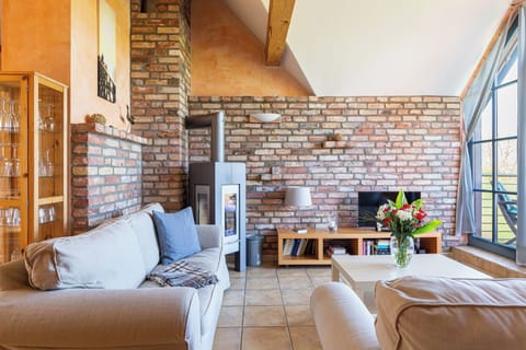Bright Living Room with Sofa and Dining Table