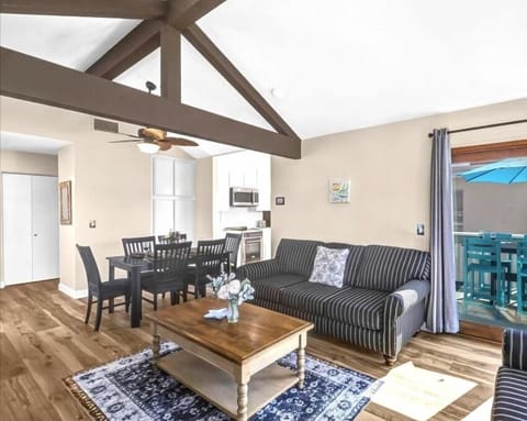 Relax with ocean views from couch & balcony at Dolphin Sanctuary.