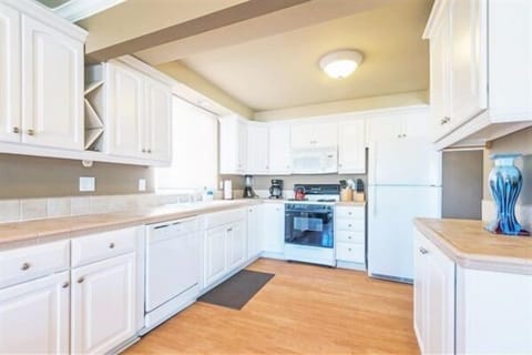 Upper unit kitchen. Dishwasher, microwave, blender, crockpot,12 cup coffee maker and cook/dinnerware