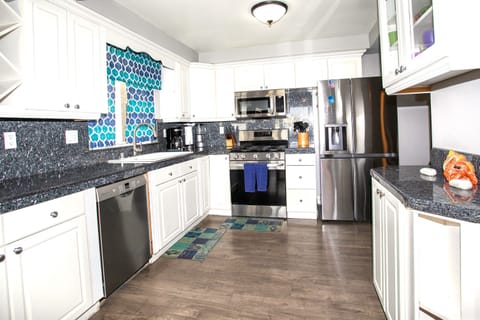 Kitchen w/ fridge, ice maker, stove, oven, micro & dishwasher