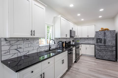 [Kitchen] - Keurig. Extensive prep areas! All black stainless appliances. Gas stove. French door fridge w/ice. Dishwasher. Microwave. Single basin undermount sink.