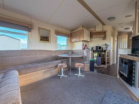 Cozy living and dining area with panoramic windows