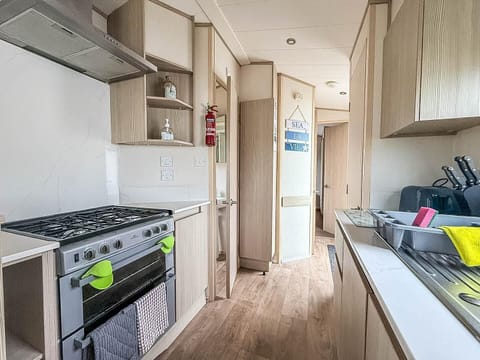 Bright, modern kitchen with ample storage and natural light