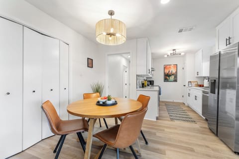 Table expands to fit 6 (2 chairs are tucked away in the closet).