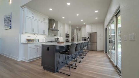 Modern Luxury Meets Comfort — Cook, Gather, and Create Memories in This Stunning Chef’s Kitchen with Seating for Six.
