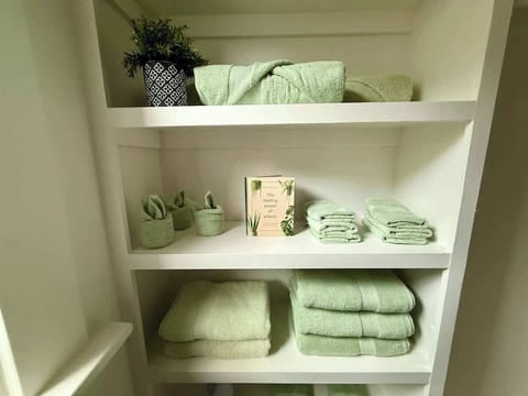 fully stocked bathroom with toiletries, towels, & more stress-free stay
