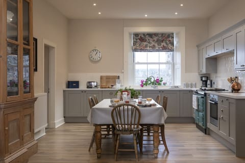 New Ladykirk Farmhouse - the open-plan farmhouse kitchen with an AGA and dining table
