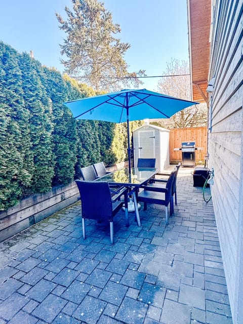 Outdoor patio with bike storage, BBQ and seating for 6.