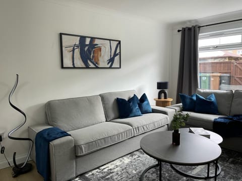 Step into style and comfort in this modern lounge—featuring plush seating, elegant decor, and plenty of natural light for a relaxing stay.