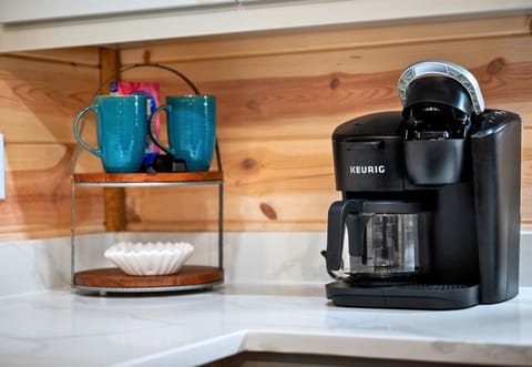 Coffee lovers, rejoice! This charming little coffee station is ready for your morning brew or an afternoon pick-me-up.