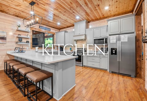 This gorgeous kitchen is a gathering place for laughter, good food, and sharing stories around the oversized island.