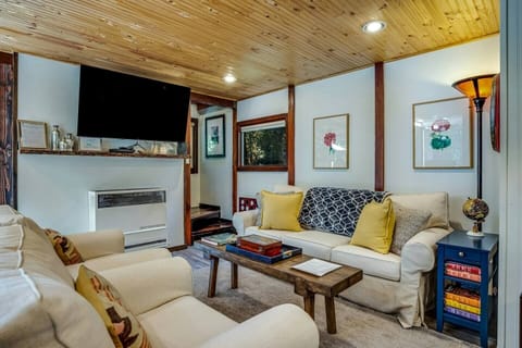 Unwind in the living room with a smart TV, perfect for movie nights.