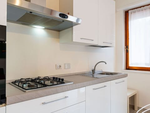 Kitchen, Countertop, Kitchen Appliance, Major Appliance, Cabinetry, Interior Design, Kitchen Stove, Wood, Stove, Kitchen Sink