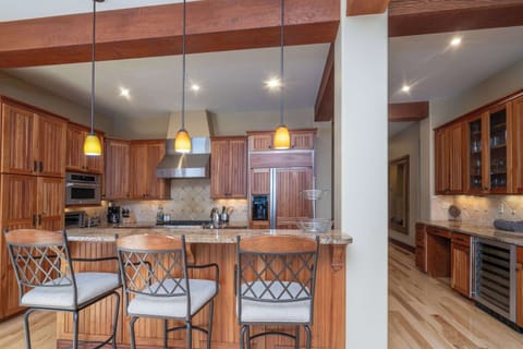 Kitchen: Drip coffee maker, stovetop kettle, cooking utensils, tableware