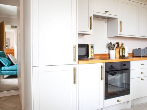 Furniture, Wood, Interior Design, Cabinetry, Kitchen, Flooring, Countertop, Cupboard, Room, Wood Stain