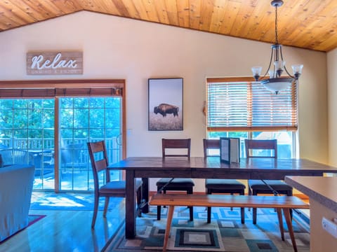 Gorgeous, solid wood dining table surrounded by the forest, seats eight