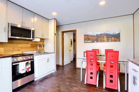 Experience the convenience of a fully equipped kitchen and shared outdoor BBQ nearby.