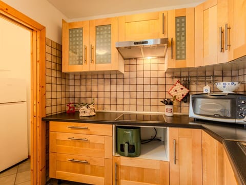 Kitchen, Countertop, Kitchen Appliance, Furniture, Cabinetry, Wood, Interior Design, Major Appliance, Flooring, Lighting